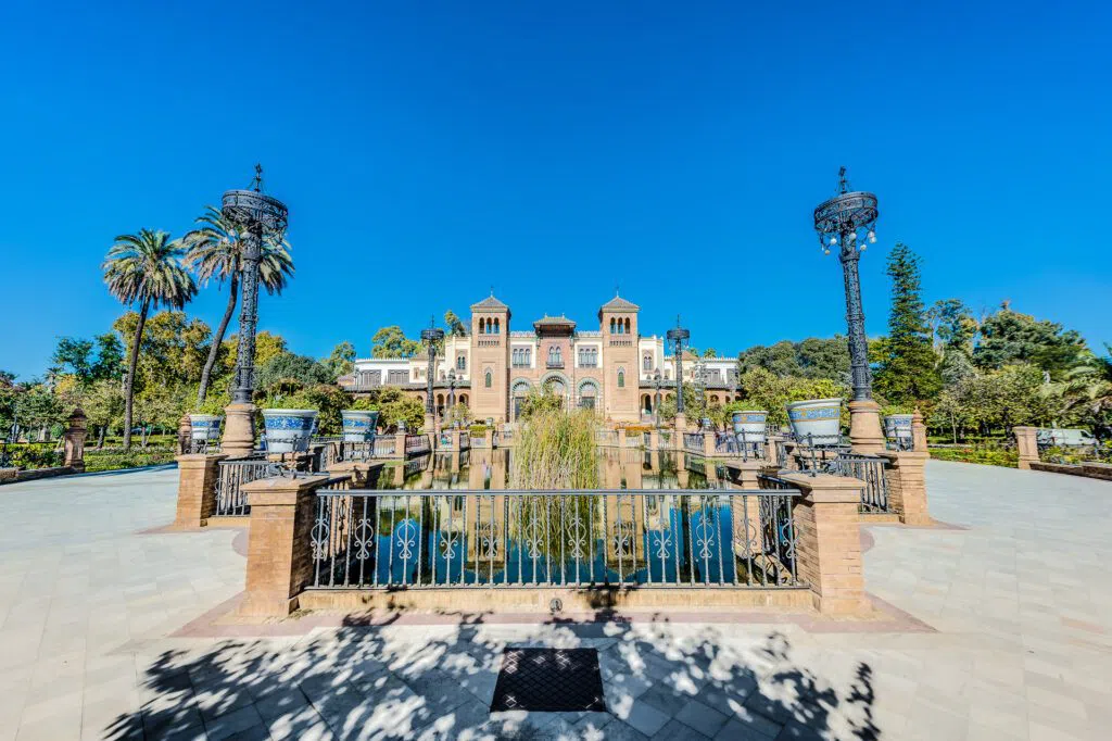Tiled benches and October shade in Seville's Maria Luisa Park